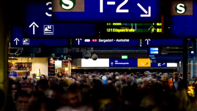 crowed-people-walking-in-illuminated-central-station-timelapse