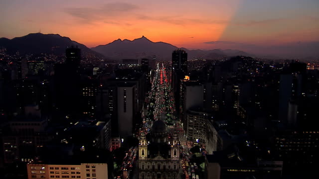 Flying-above-Rio-de-Janeiro-Downtown-street-at-Dusk,-Brazil