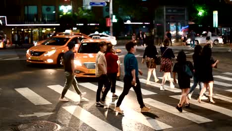 Still-shot-of-pedestrians-crossing-the-road-at-Itaewon