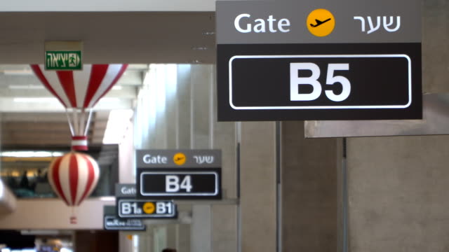 Airport-gate-sign-in-row
