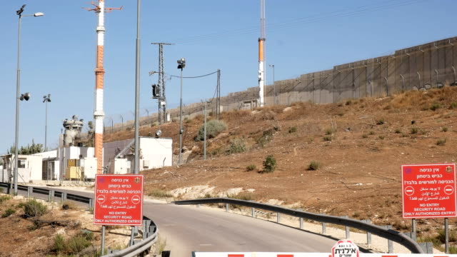 a-view-of-a-checkpoint-post-and-sercurity-tower-on-the-border-between-palestine-and-israel