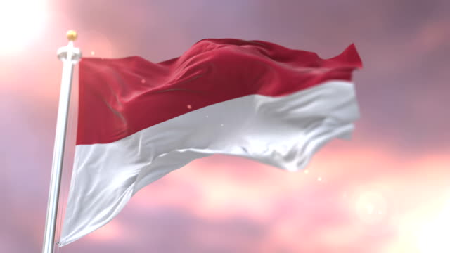 Bandera-de-Indonesia-ondeando-en-el-viento-lento-en-puesta-de-sol,-lazo