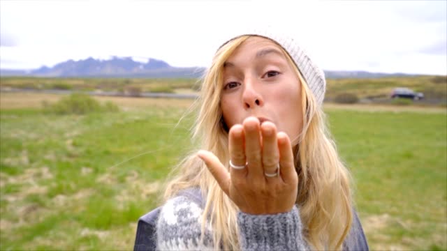 Young-woman-blowing-a-kiss,-Iceland,-slow-motion