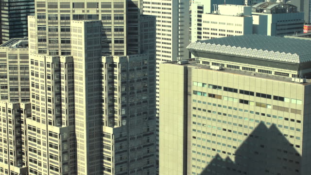 Aerial-Footage-of-the-Big-Cityscape,-with-Skyscrapers-and-Busy-Traffic.-Daytime-in-the-Megapolis-City.