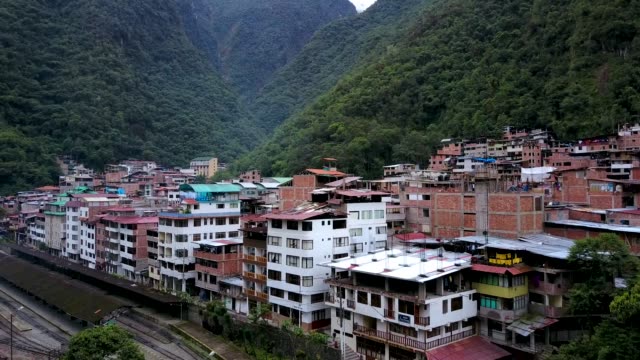 Aerial--view-on-old-Latin-town.-Big-river-flowing.-Mountains-on-the-background.