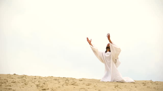 Arab-raising-hands-to-heaven,-praying-on-knees,-asking-Allah-to-forgive-sins