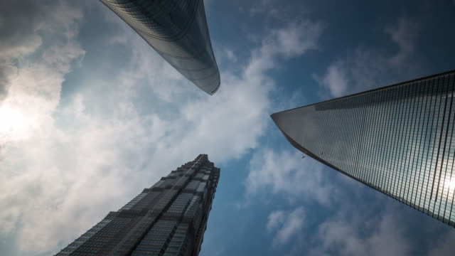 china-shanghai-summer-day-roof-top-downtown-buildings-sky-up-view-4k-time-lapse