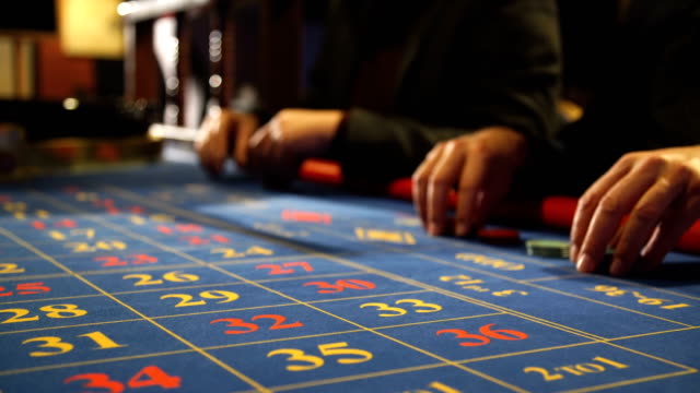 Two-men-playing-roulette-in-a-casino