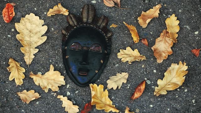 Carnaval-Mask-Autumn-leafs-Moscow-street-hd-footage-evening