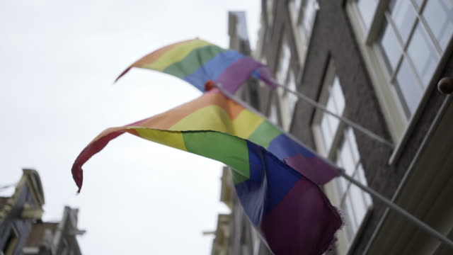Colorful-rainbow-flags-waving-on-street