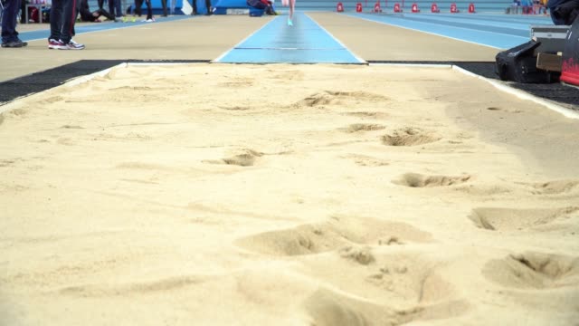 Athlete-practicing-high-jump-at-sports-venue-4k