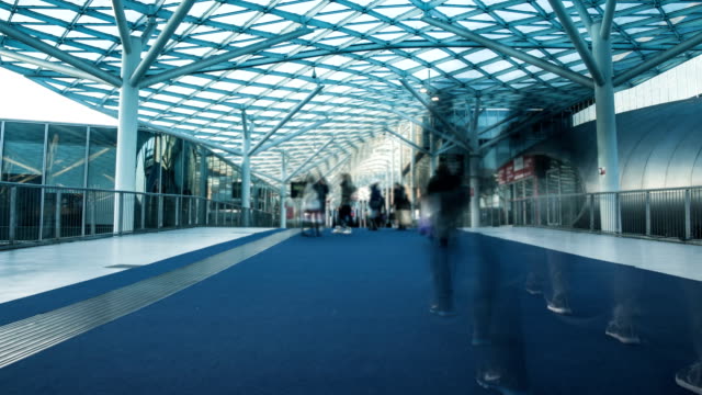 Futuristic-building-and-walkway-with-fast-people