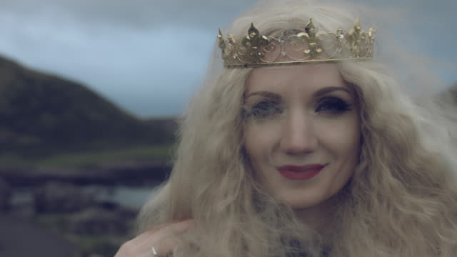 4k-Fantasy-Shot-of-a-Queen's-Face-smiling-at-Camera,-Giant's-Causeway-location
