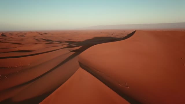 Aerial-of-sand-dunes-in-Sahara-desert-at-sunrise