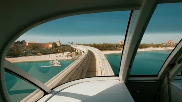 view-from-windshield-of-wagon-of-monorail-train-in-Dubai,-moving-over-Palm-Jumeirah