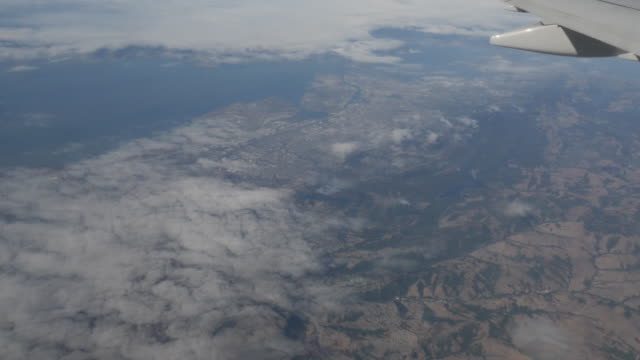 Aerial-view-of-San-Francisco-and-Oakland-Suburbs-out-of-plane-window-4k