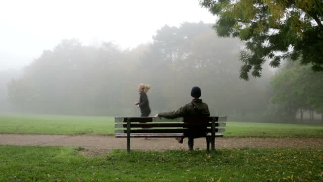 man-on-bench-in-park
