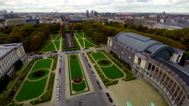 Brussels-park-fly-through,-traffic-tunnel-cars,-aerial-city-view.-Beautiful-aerial-shot-above-Europe,-culture-and-landscapes,-camera-pan-dolly-in-the-air.-Drone-flying-above-European-land.-Traveling-sightseeing,-tourist-views-of-Belgium.