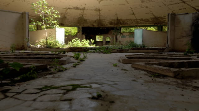 Walking-in-the-abandoned-building-in-Tskaltubo,-Georgia