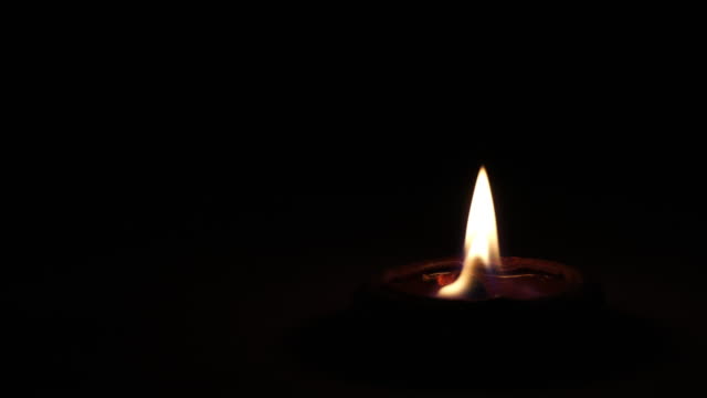 Blackout-candle-in-small-pottery-container.