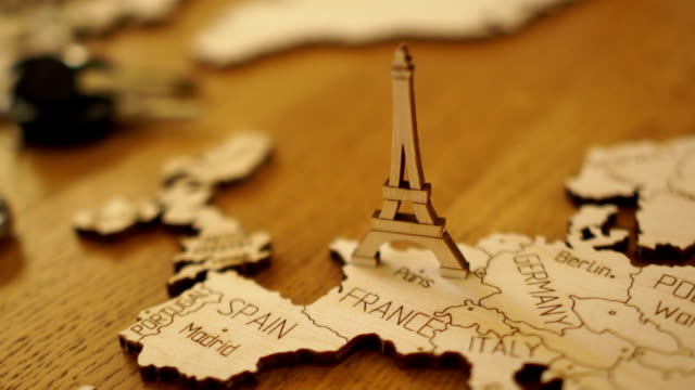 The-camera-gradually-focuses-on-the-wooden-model-of-the-map-of-Europe.-Model-of-wood-Eiffel-Tower.-Attractions-in-Paris,-France