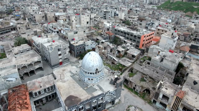 Aerial-view-over-a-mosque-ravaged-by-war