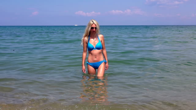 Beautiful-blonde-girl--against-the-sea,-Greece