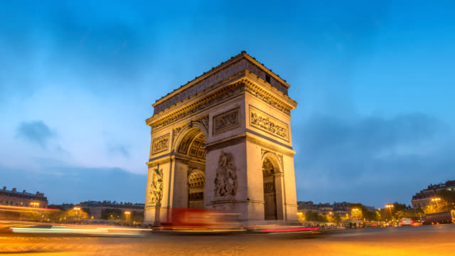 Paris-France-time-lapse-4K,-city-skyline-night-to-day-timelapse-at-Arc-de-Triomphe-and-Champs-Elysees