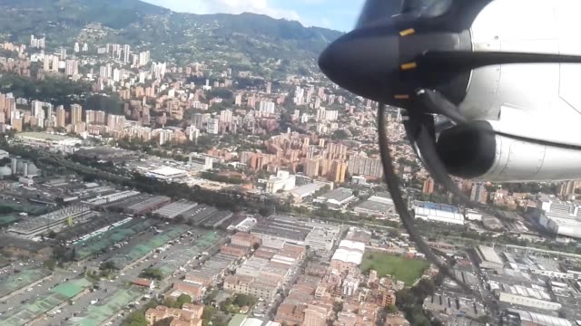 Colombian-city-of-Medellin.-Buildings,-metro,-mountains-and-river.