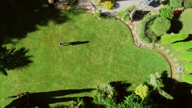 Aerial-view-of-person-in-private-garden-around-house.
