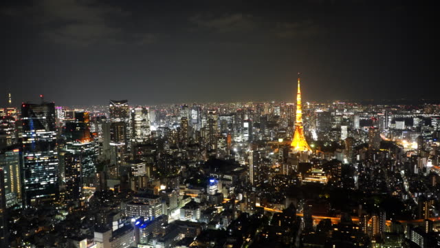 wide-angle-pan-of-tokyo-tower-at-night-from-mori-tower-in-tokyo
