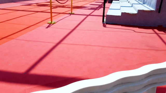 Red-carpet-on-stairs-in-entrance-of-Palais-des-Festivals-et-des-Congres,-Cannes