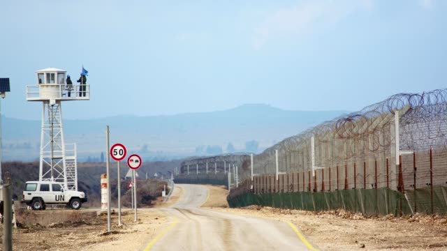 Border-of-Syria-and-Israel.-Tall-fences-with-military-posts-and-UN-soldiers