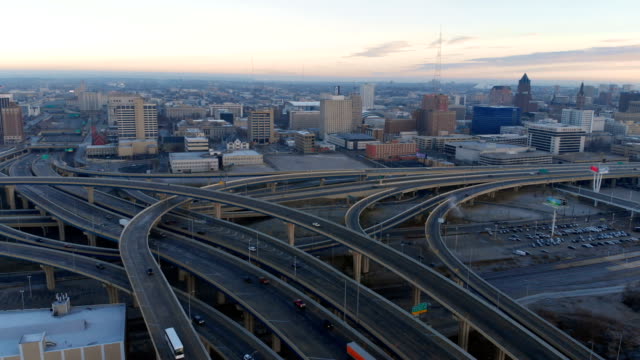 Aerial-view-of-highway-in-american-city-at-dawn.-Downtown-Milwaukee,-Wisconsin,-United-States.-Drone-shots,-from-above