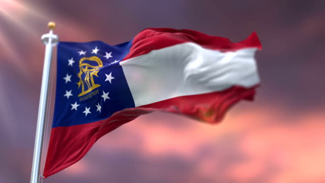 Flagge-des-amerikanischen-Staates-Georgia,-Region-der-Vereinigten-Staaten,-bei-Sonnenuntergang-Schleife
