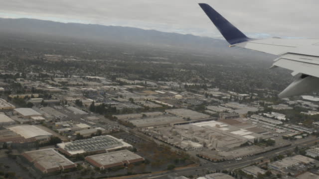 Aerial-view-of-San-Jose-Suburbs-out-of-plane-window-4k