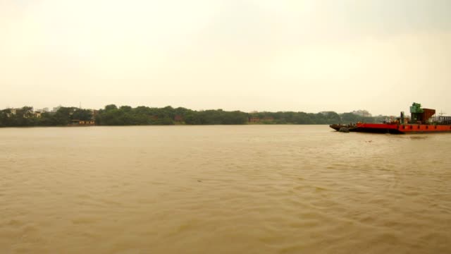 barge-floats-on-river-Hoogli-trees-and-some-buildings-on-bank
