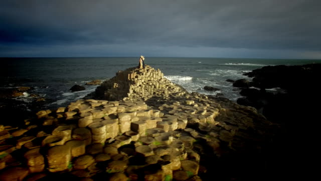 4k-Aerial-Shot-of-a-Queen-on-Giant's-Causeway-and-3D-Animated-text-"Nature"