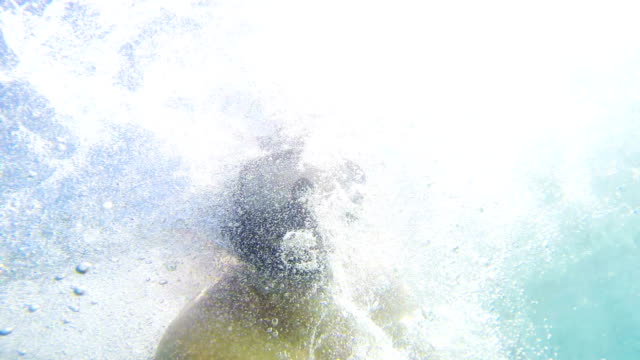 Snorkeling-men-drawning-from-shark-attack,-view-from-underwater,-uhd-shoot