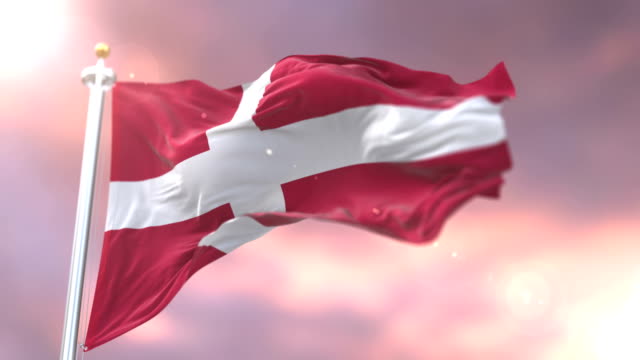 Denmark-flag-waving-at-wind-at-sunset,-loop