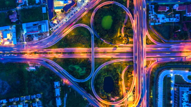 Aerial-view-Top-view-Time-lapse-of-the-expressway,-motorway-and-highway-in-the-detail-of-intersection-at-night