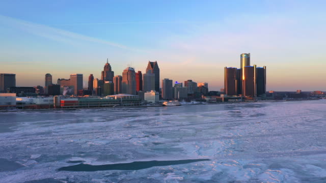 Frozen-Detroit-river-Renaissance-center-aerial-view-Winter-at-Sunset