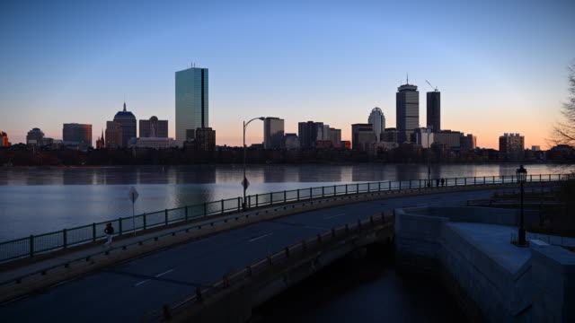Time-lapse-of-the-Boston-skyline-during-sunset-overlooking-the-frozen-Charles-River-from-the-Cambridge-side