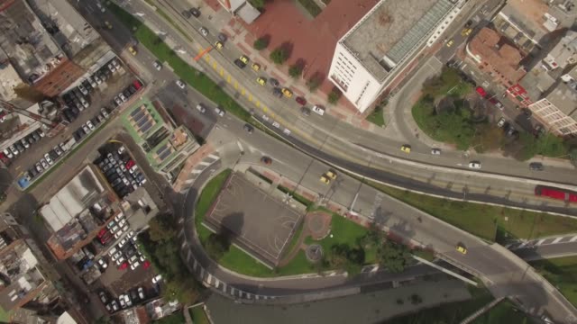Top-down-aerial-of-downtown-Bogota-traffic-and-office-buildings