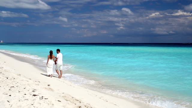 Young-beautiful-newlyweds-on-beach