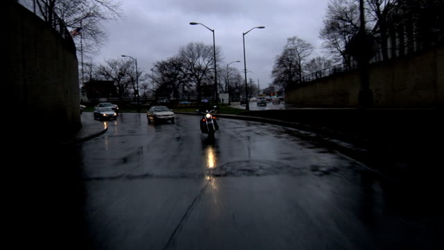 Motorcycle-Going-Through-Tunnel-in-Rain