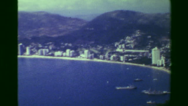 1978:-Acapulco-harbor-bay-hotel-beach-resort-area-high-perspective-view.