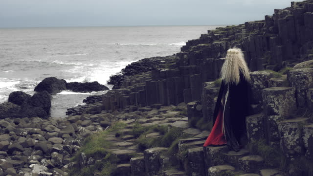 4k-Fantasy-Shot-on-Giant's-Causeway-of-a-Queen-Showing-at-the-Ocean