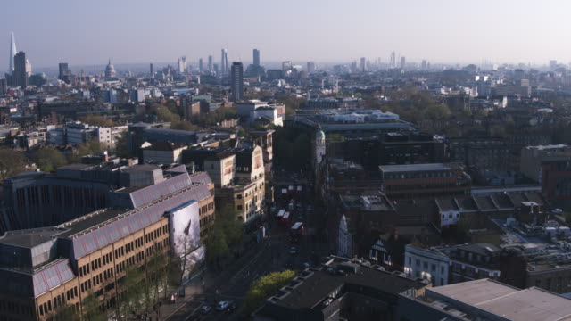 Aerial-view-flying-over-downtown-city-streets-London