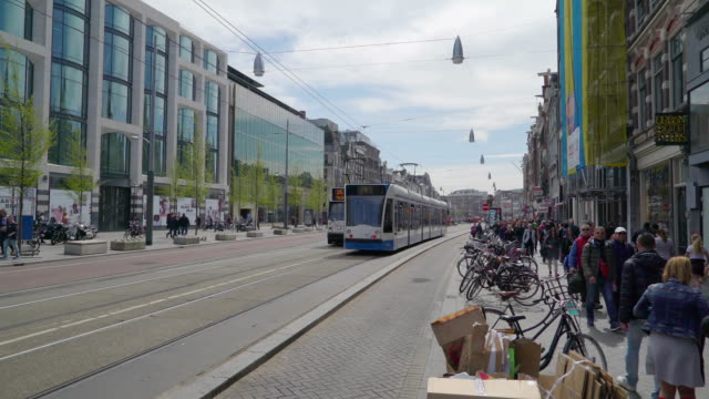 Two-trams-transport-moving-on-the-streets-in-Amsterdam